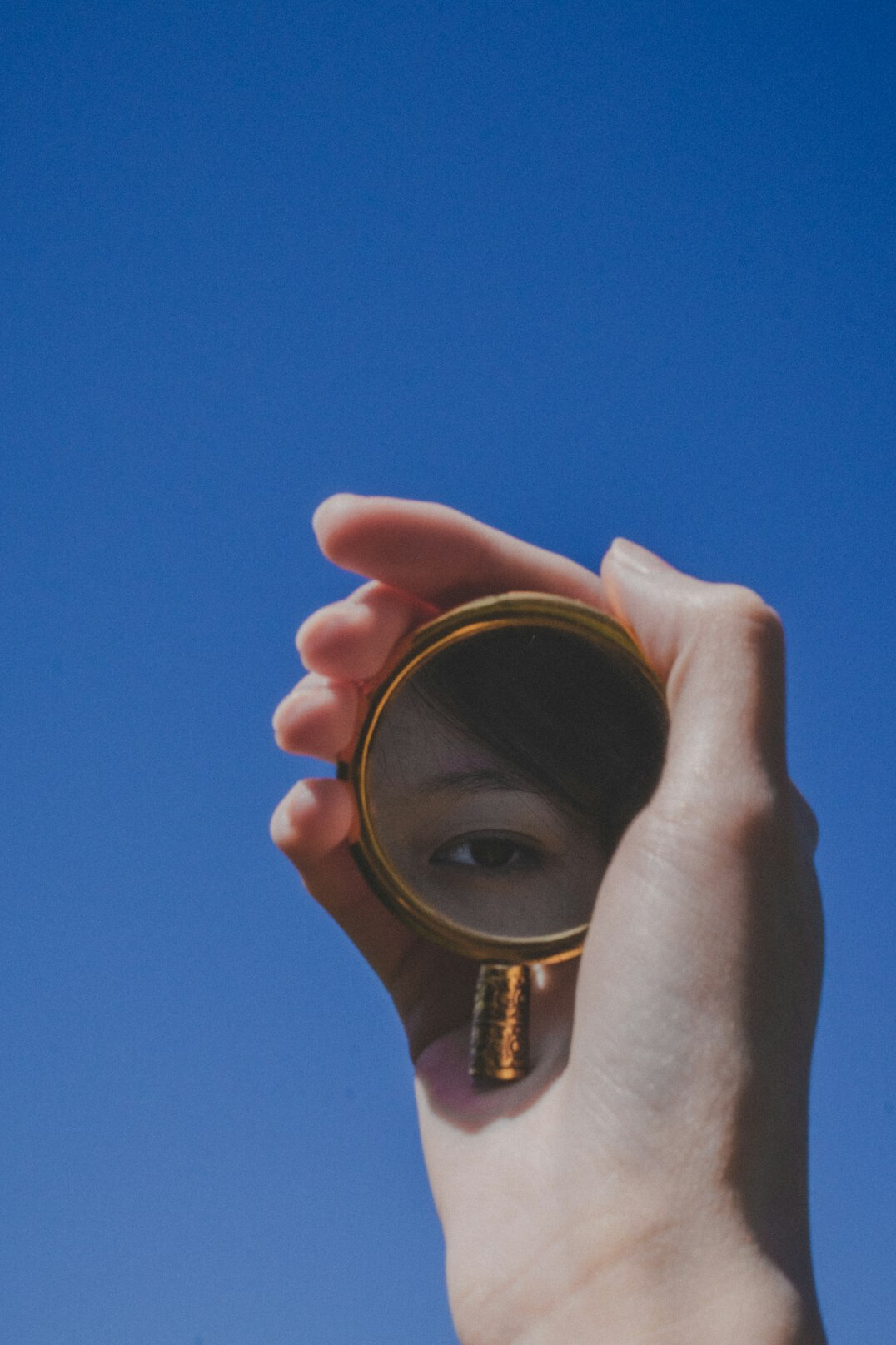 person reflecting in mirror