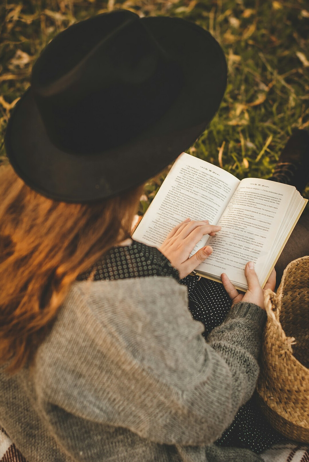 woman reading self improvement book