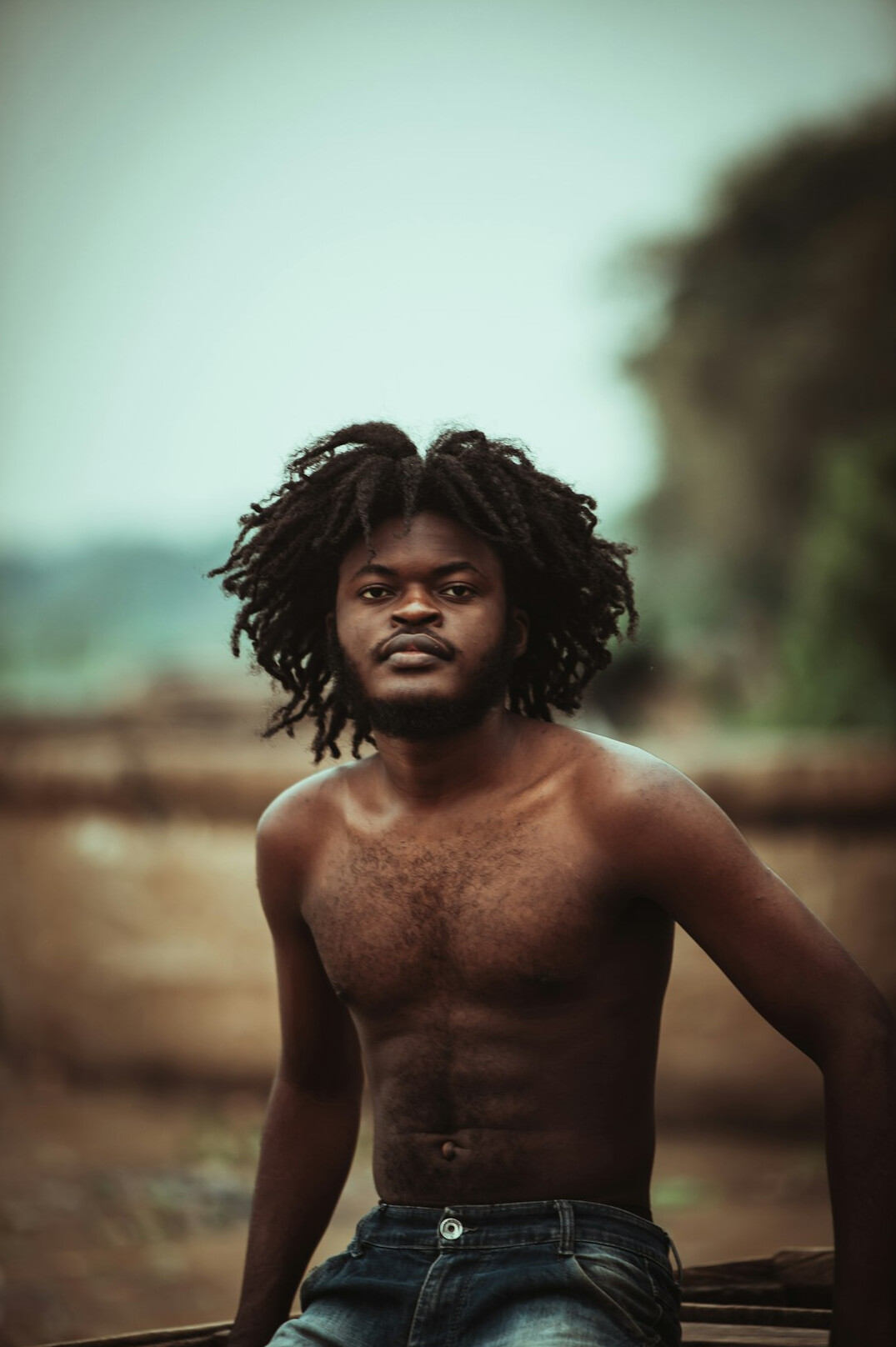 Portrait of an Afro-Brazilian man smiling in a studio setting